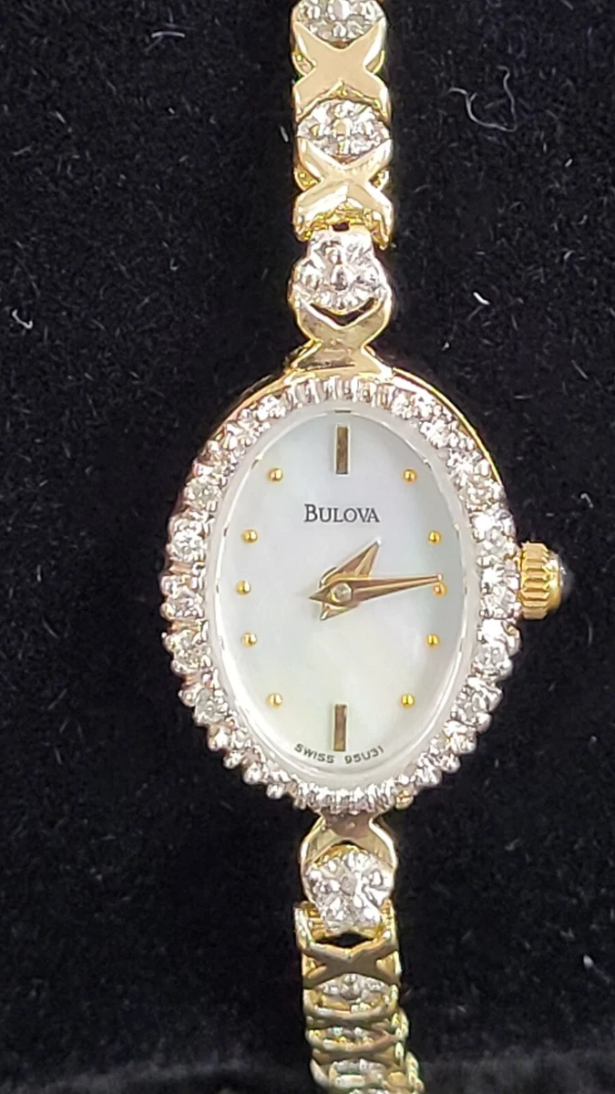 Bulova 14 karat Gold Lady s watch with 16 Diamonds