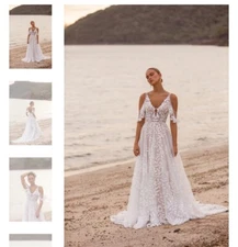 New beautiful wedding gown never worn! Designer is Madi Lane, size 18, fits 14.