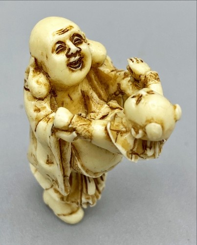 Netsuke PEM Monk holding a Child