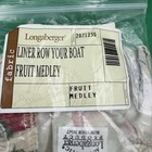 Longaberger Row Your Boat Fabric Liner Only box with green lid, yellow label, and white text reading “Fruit Medley.”