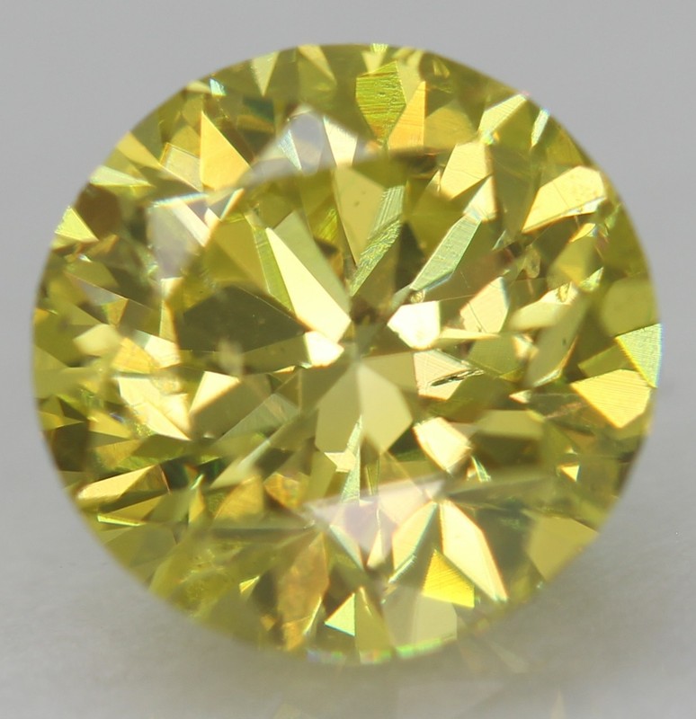 Cert 0.76 Carat Canary Yellow VVS2 Round Brilliant Natural Enhanced Diamond 5.7m