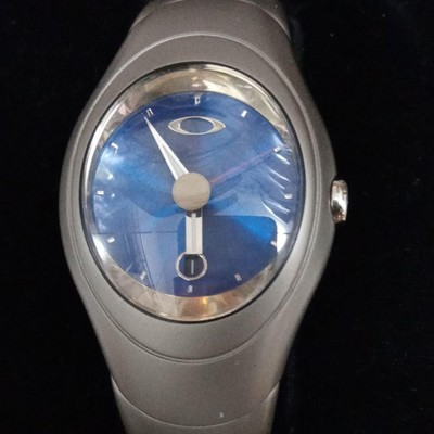 Oakley Time Bomb Icon Blue Dial Titanium Metal Analog Wristwatch 