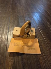 small shuttle, a component of a narrow fabric loom used for weaving labels