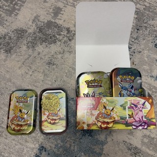 Pokemon Prismatic Evolutions Mini Tins x 8 Art Set. Leere Dosen Münzen dabei