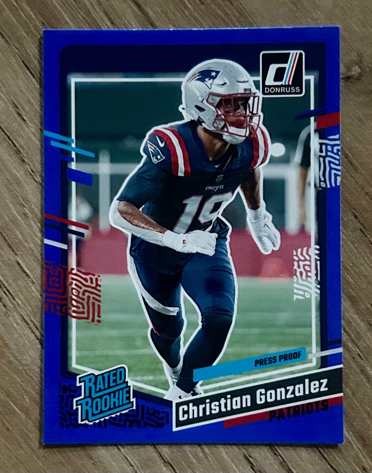 2023 Donruss #369 Christian Gonzalez Rated Rookie Blue Press Proof Patriots
