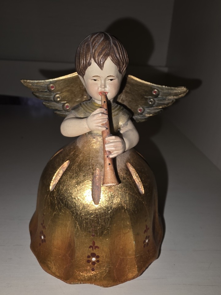 A Swiss Reuge angel-and-horn music box playing 'Silent Night' — a rare, genuinely lovely Christmas collectible with Swiss movement precision.