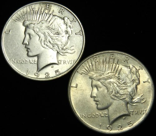 1925(P) TWO CIRCULATED PEACE SILVER DOLLARS, AU GRADE, LIGHTLY CLEANED