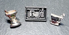THREE PHARMACY RELATED PINS: REVCO 5, POSTAGE STAMP, RX E301