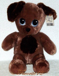 puppy hugging teddy bear