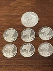 Silver Rounds, Six 1 Gram Walking Liberty, And One 1/10 Troy Ounce Indian Head