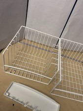 2 different sized white metal baskets for fri...