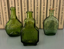 3 small miniature green glass bottles