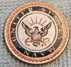 A collectible US NAVY Kennedy half dollar coin