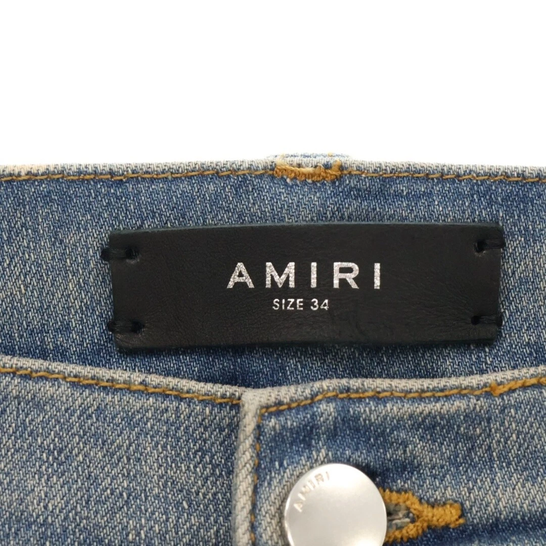 AMIRI Pantalone denim svasato con bottoni laterali colore indaco
