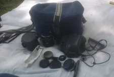 Canon T70 28 - 50mm SLR film camera with bag, and 2 lenses & Other Accessories 