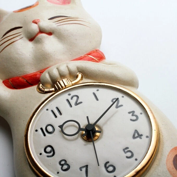 Waving cat clock deals