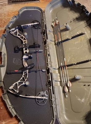 Two left handed compound bows, bowtech assassin and bear archery odyssey 2