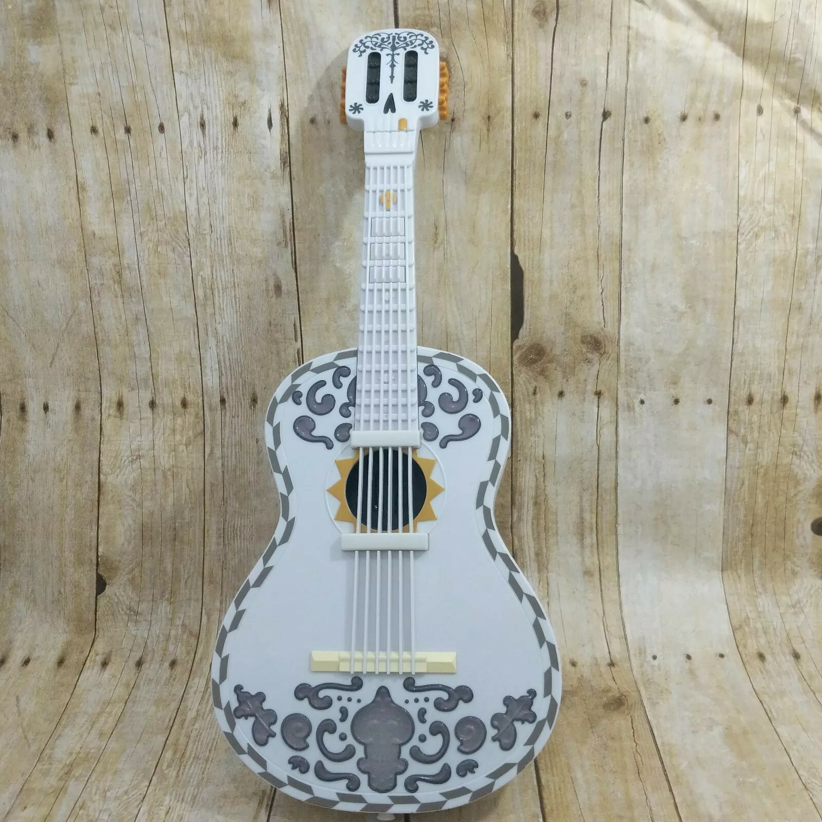 white toy guitar