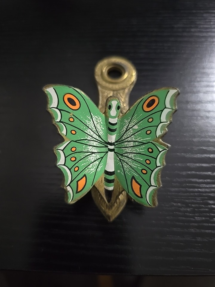 Solid brass butterfly clip in Allied Brass green finish — a whimsical, well-crafted vintage desk tool that's actually useful.
