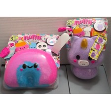 Fluffie Stuffiez collectible plush toys: a Rainbow and a Unicorn both NIB