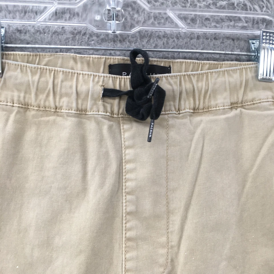 Pantalones de chándal Pacsun para hombre medianos beige cintura elástica ajuste ajustado cremallera tobillo Foto 4 de 4