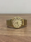 Vintage 1980's Timex Marlin Time/Date Gold Tone Mens Watch/Stretch Band