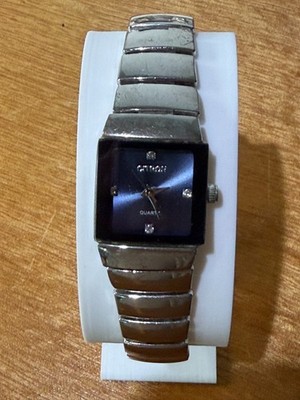 Lady's Silver Tone Rectangular Watch Deep Blue Dial Crystal Markers Stretch
