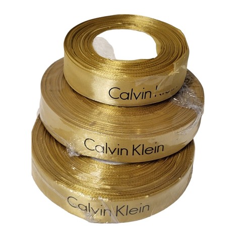 AUTHENTIC Calvin Klei Gift Wrap Ribbon Golden NEW Aprox 75 yards