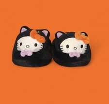 Black Halloween Sanrio Hello Kitty plush slippers with orange accents, size 7-8