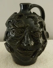 Stoneware 6 1/4" Tall Pottery Face Jug, Man's Face among Leaves