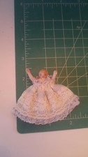Doll house miniature Beautiful Vintage Bisque doll in a stunning dress . 