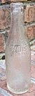 VINTAGE WHISTLE CLEAR EMBOSSED 6.5 FL. OZ. SODA BOTTLE