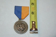 vintage soccer medal pin on NYSA Novato Youth Soccer Association women's medalli