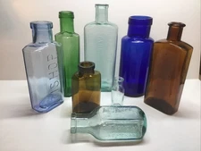 Antique 8 Piece Colorful Cork Top Bottle Lot.