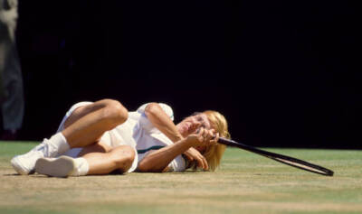 Martina Navratilova of the USA on the ground after falling during - Old Photo