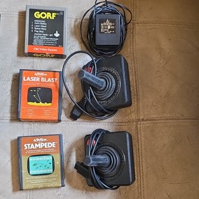 Atari 2600 4 switch model with Controllers & 8 game cart bundle READ DESCRIPTION
