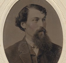 PORTRAIT OF YOUNG MAN W/ LIGHT EYES, RED TINTED CHEEKS, AND LONG BEARD