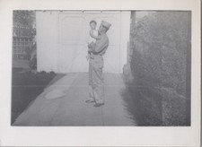 WW2 Photo of Navy Officer Holding Baby Outside Garage