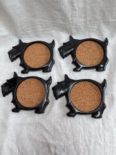 older set 4 plastic black body SCOTTIES SCOTTYS coasters with round cork inserts
