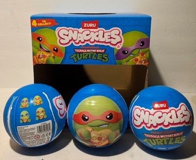 NEW  Lot of 3 -5  Teenage Mutant Ninja Turtles Snackles & Display case included