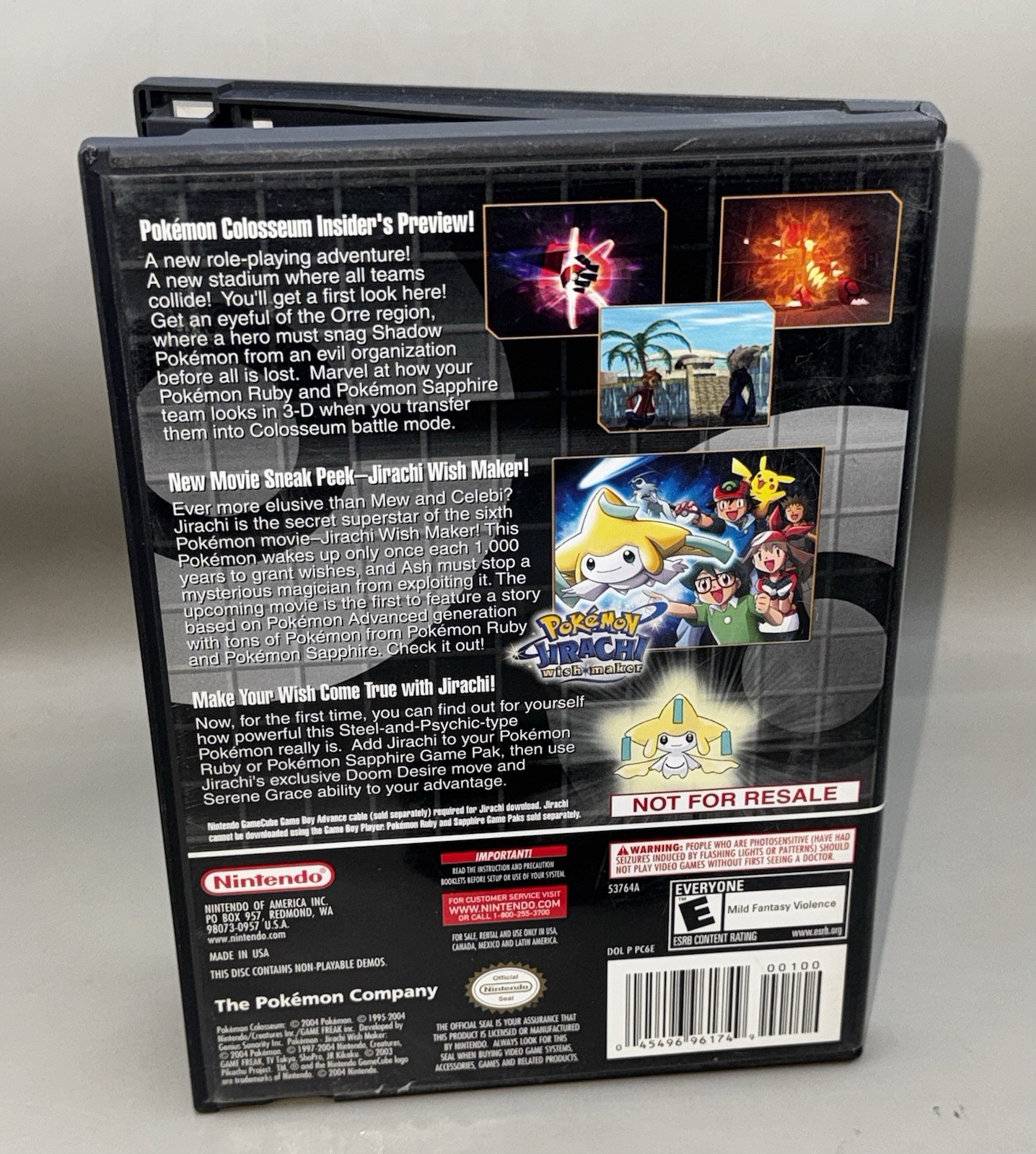 Black Nintendo GameCube case for Pokémon Colosseum Bonus Disc featuring Jirachi artwork with gold accents and Nintendo logos.