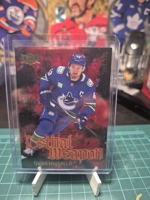 Quinn Hughes 2025-26 SkyBox Metal Universe #LW-7 Lethal Weapon Red /100