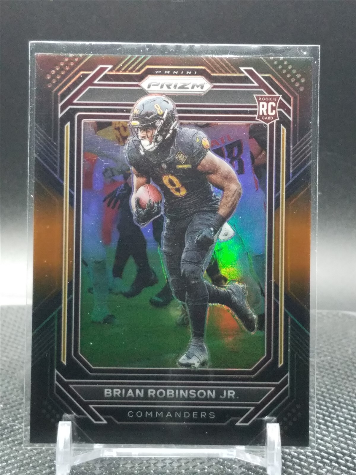 2022 Panini Chronicles Brian Robinson Jr. Prizm Black Orange /75 Commanders