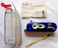 Vintage I-ZONE polaroid camera with it's instructions outer carry case and strap