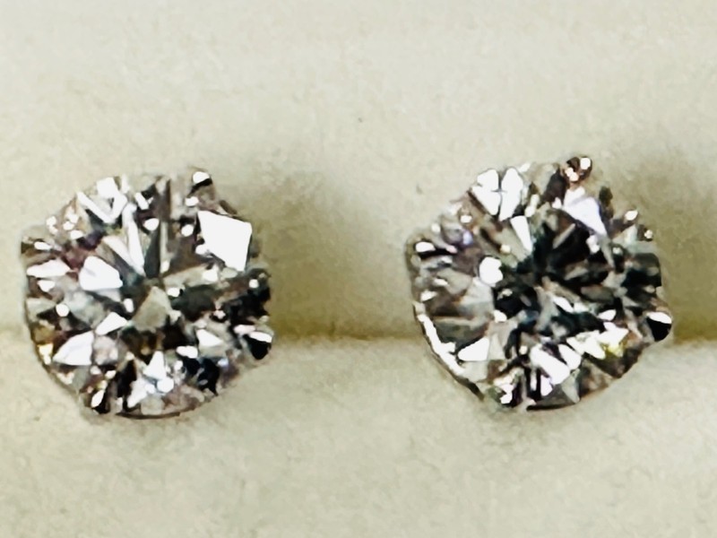 A pair of stud earring set in 14 karat white gold with lab grown diamonds 