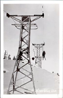 RPPC - Easy Way Up - Skiers on Ski Lift up Mountain