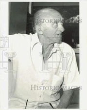 1984 Press Photo Retired worker Romeo Tarino talks during interview - lra87119