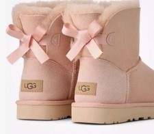 Ugg Women's Mini Bailey Bow Genuine Shearling Bootie Blush Color 8 US authentic