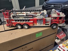 Metro F.D. Battery Operated Fire Truck Toy Red with Ladder and Controls