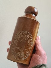 PICTORIAL SALT GLAZE GINGER BEER BOTTLE FROM MANCHESTER IN GOOD CONDITION.